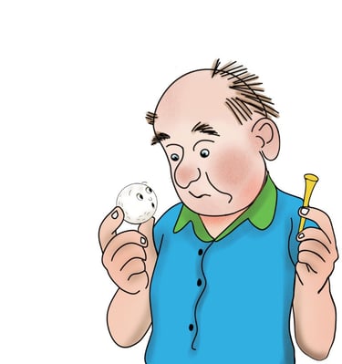 man holding a golf ball and tee