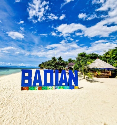 lambug beach with the sign saying badian - just waiting for YOU to take a picture