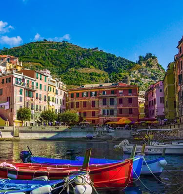 italian town with colorful boats on water