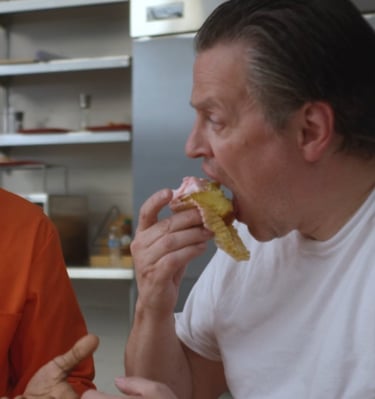 Ethan Eating an Ivana Cake talking to Marcus - Prisoner Trump Imagein Cafeteria