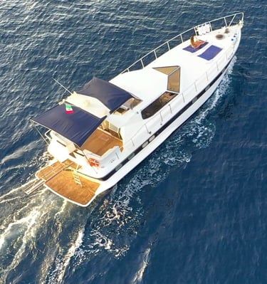 a boat with a blue sky and a boat in the water