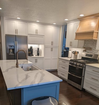 a kitchen with a farm style sink in the island
