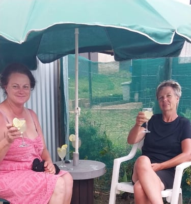 Two lady clients having a post massage drink