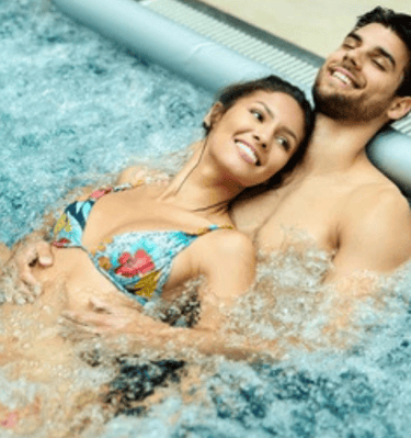 a man and woman in a hot tub