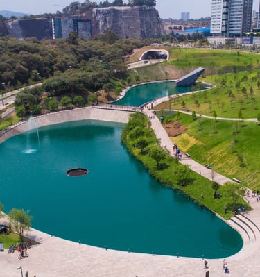 a large pond with a fountain and a fountain