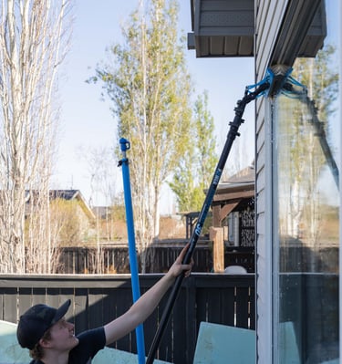 Man cleaning a residential window