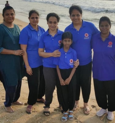a group of people standing on a beach