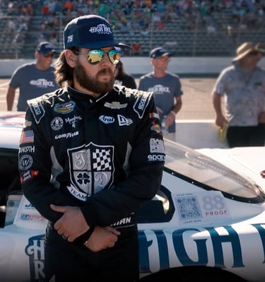 Landon Huffman waits to race at North Wilkesboro in the High Rock Vodka car