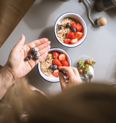 photo of vibrant breakfast fruit bowl being prepared 
