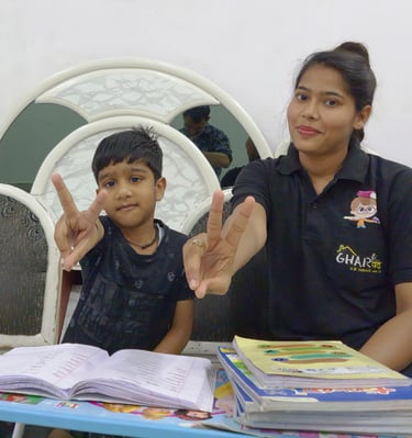 a woman sitting at a table with a child