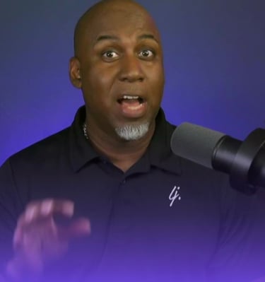 Lee Jones in a black shirt and a microphone