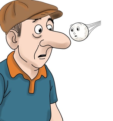 golf ball flying past the nose of a man in a cap