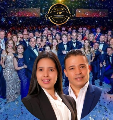 a man and woman posing for a photo with confettitti