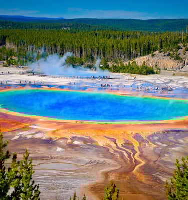 Vibrant Grand Prismatic Spring in Yellowstone National Park with colorful rings and steam.