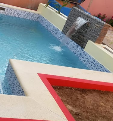 a pool with a red and white pool and a red and white pool
