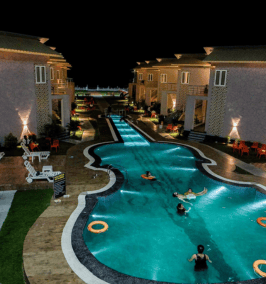 a pool with people swimming in the water