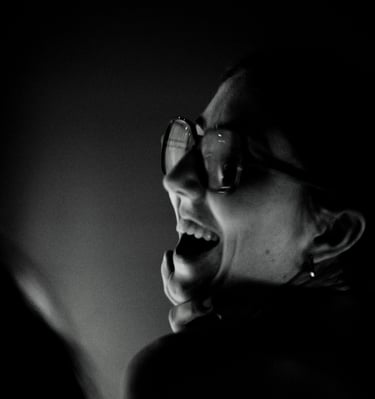 a woman with a toothbrush and a toothbrush in her mouth