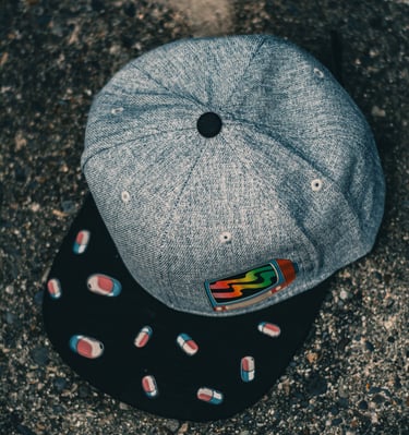 a hat with pills and pills on it