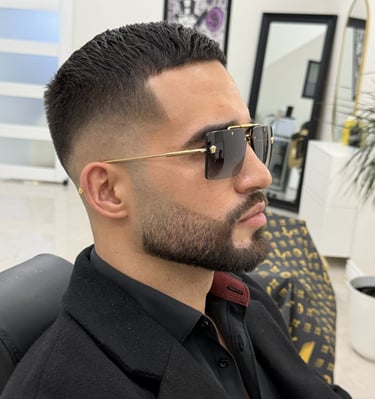 Tapered skin fade and beard trim grooming service at Unlimited Barbershop Etobicoke.