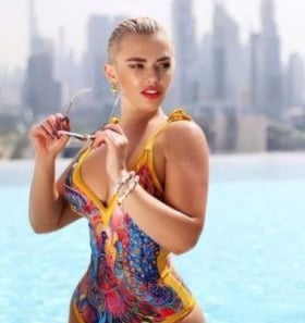a woman in a swimsuit is posing for a picture