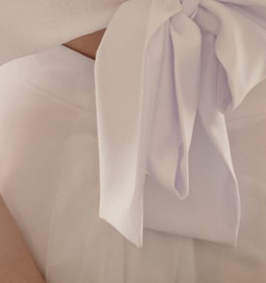 a woman in a white dress with a white dress