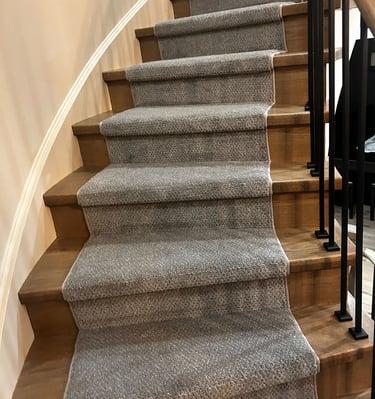 Grey pattern carpet runner installed on hardwood stairs – stylish and durable stair runner in London Ontario home