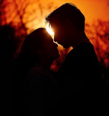 Silhouette photograph of a couple in evening sky