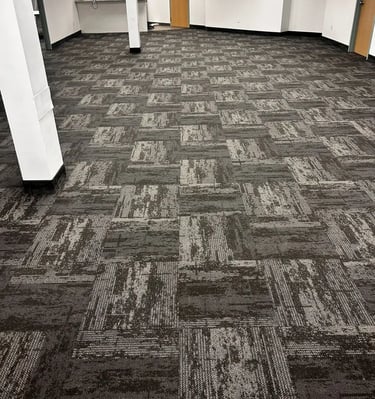 Dark grey design commercial carpet tile installed in conference room, London downtown office