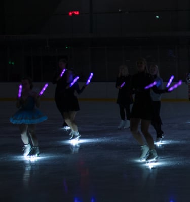 Adult figure skaters dancing flashmob