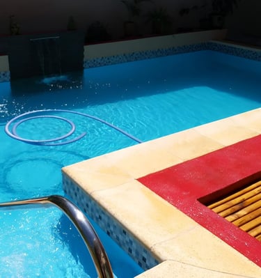 a pool with a hose attached to a pool