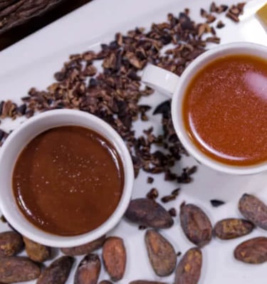small cups filled with sipping chocolates in a variety of flavors