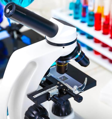 in a laboratory with microscope and sample tubes