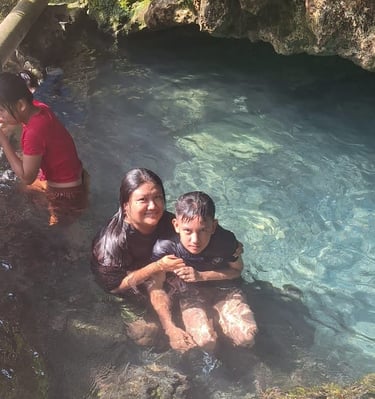 Relaxing in the water in Busay Cave