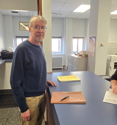 Steven Rugh getting his petition checked in at the County Office