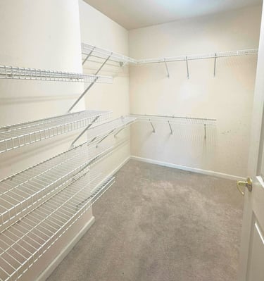 a closet with a closet space for clothes and other items