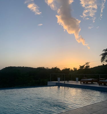 a pool with a cloud in the sky