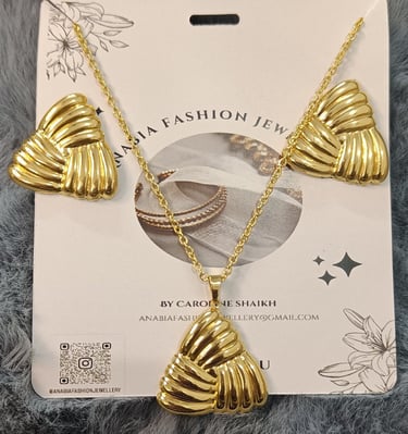 a gold plated necklace with a gold plated shell shell shell shell shell shell