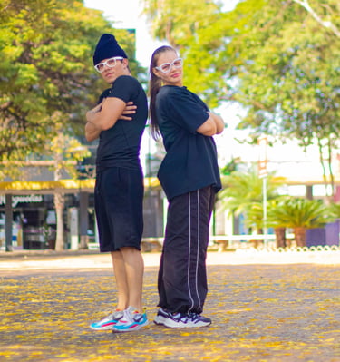a couple of people standing in a park