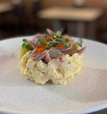 a person holding a plate with food on it