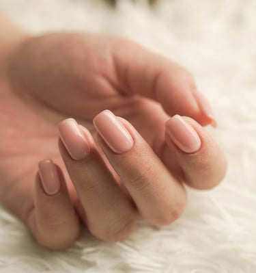 a woman's hand with a manicured manicured nail polish