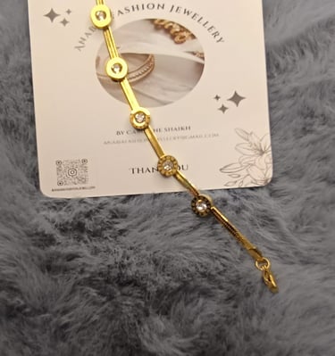 a gold bracelet bracelet with a gold chain bracelet
