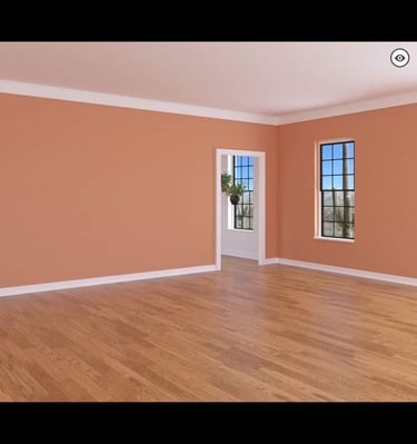 a room with wooden floor, newly painted walls, everything newly renovated.