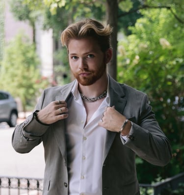 a man in a suit jacket and a white shirt