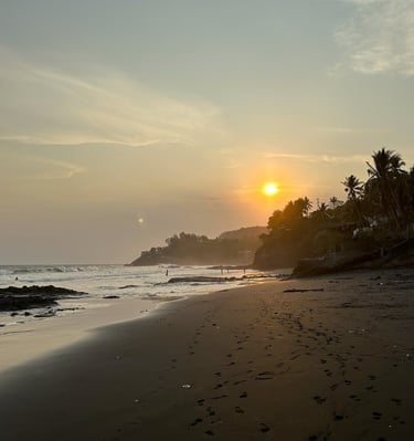 people enjoying the sunset at el zonte beach 