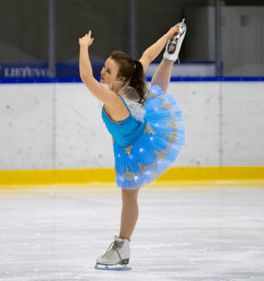 Adult figure skater performing element 5