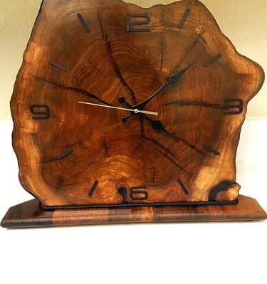 Edged wooden slab clock for table or shelf.
