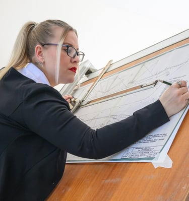 Model posing at a draftsman table during a studio photoshoot at Pretty in Pixels Rotherham