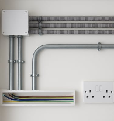 Plumber fitting heating pipes in a commercial building under construction.
