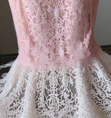 A lifestyle shot of a woman carrying a red handcrafted handbag while walking through a sunlit street market.