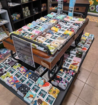 a table with a carton of cloth covered with a variety of cards